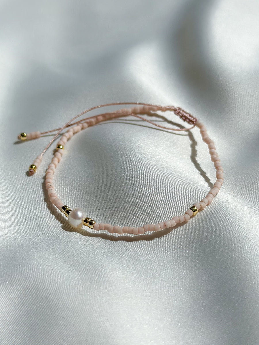 Schuif armbandje miyuki kraaltjes en pareltje - licht roze mat