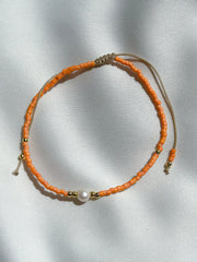 Schuif armbandje miyuki kraaltjes en pareltje - oranje