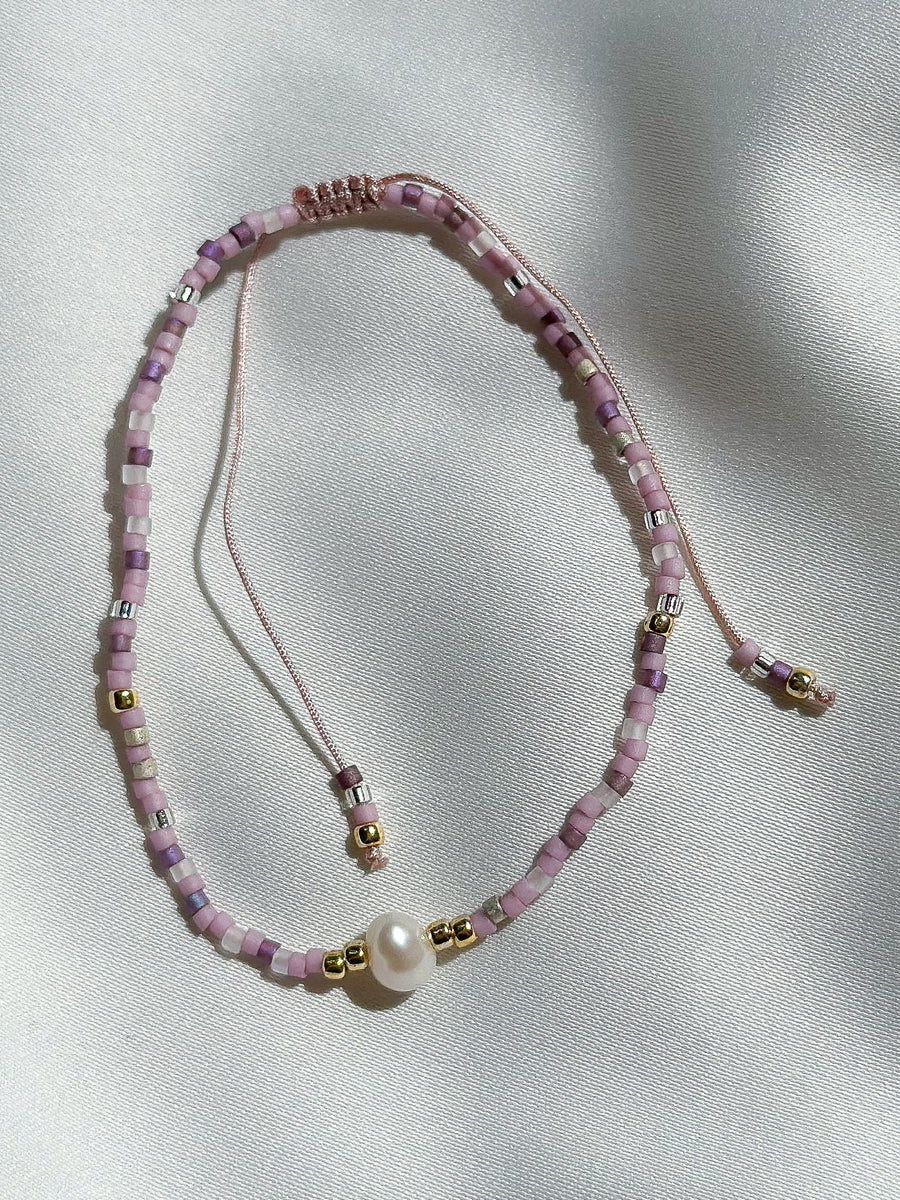 Schuif armbandje miyuki kraaltjes en pareltje - lila