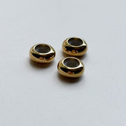 Gold sliding beads