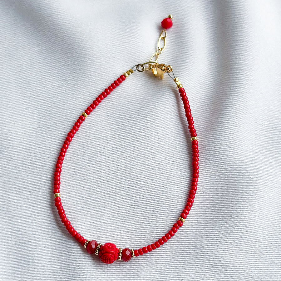 Armbandje glaskraaltjes - rood